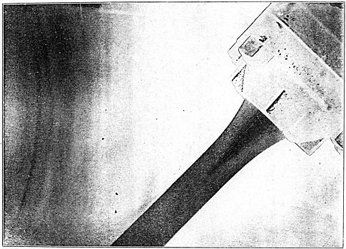 A FLASHLIGHT PHOTOGRAPH OF THE REGULATING NOZZLE AND EXCITER WHEEL IN ACTION.