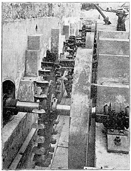 PELTON WHEELS OUTSIDE THE POWER HOUSE.