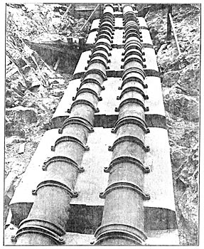 THE PIPE LINE IS ANCHORED IN MASSIVE CONCRETE PIERS.