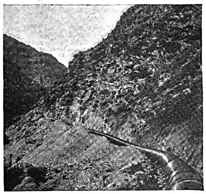 FIG. 1 � THE PIPE LINE ALONG THE SIDE OF THE CANYON.