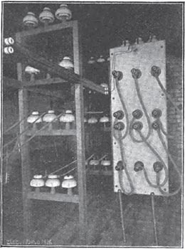 HIGH TENSION PLUG BOARD.