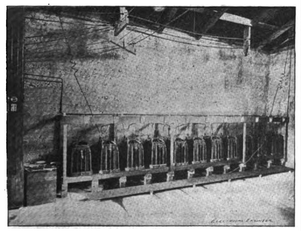 BANK OF 10,000 VOLT TRANSFORMERS.