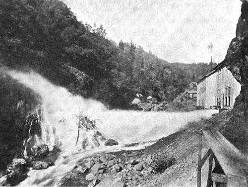 A SINGLE THREE-INCH JET IN OPEN DISCHARGE UNDER A STATIC HEAD OF 1560 FEET.