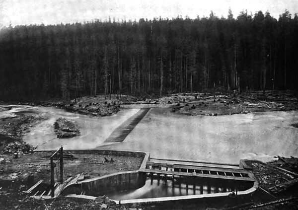 INTAKE AND DAM, LOOKING EAST, SHOWING THE UNCOMPLETED RADIAL GATE AT THE LEFT.
