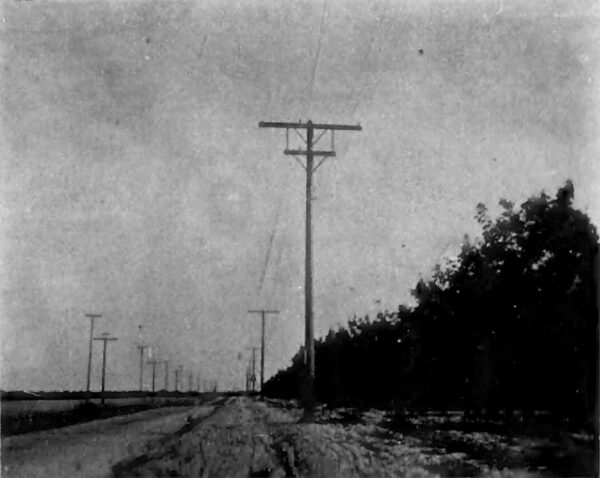 A TRANSPOSITION ON 225-FOOT SPAN WORK. ONE 10,000-VOLT CIRCUIT PREPARTED FOR TWO.