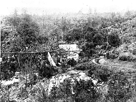 FIGURE. 3 � ANOTHER VIEW OF THE CONFLUENCE OF THE DIVERSION FLUMES, SHOWING SITE OF THE NORTH FORK DIVERSION, A PORTION OF THE DITCH AND FLUME OF THE SOUTH BRANCH OF THE NORTH FORK DIVERSION AND AN OVERFLOW GATE IN THE MAIN FLUME.