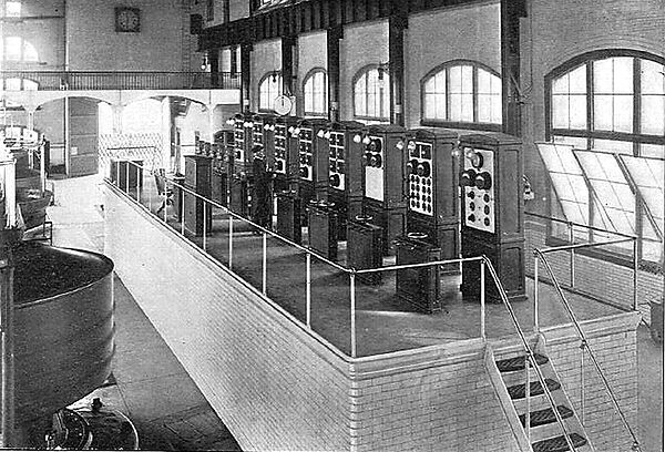 SWITCHBOARD NO. 1.  ELECTRICIAN IN CHARGE TAKING READINGS OF THE INSTRUMENTS
