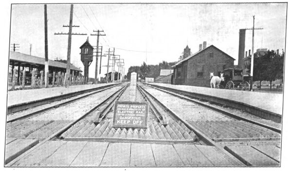 AT WHEATON, ON THE AURORA, ELGIN & CHICAGO RAILWAY, SHOWING SIDEWALK CROSSING, SIGN AND STOCK GUARD. SUPERINTENDENT