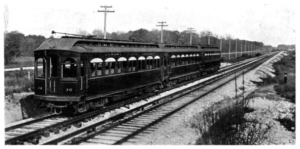 A Three-Car Electric Train Provided with Shoe Collectors and Overhead Trolleys.