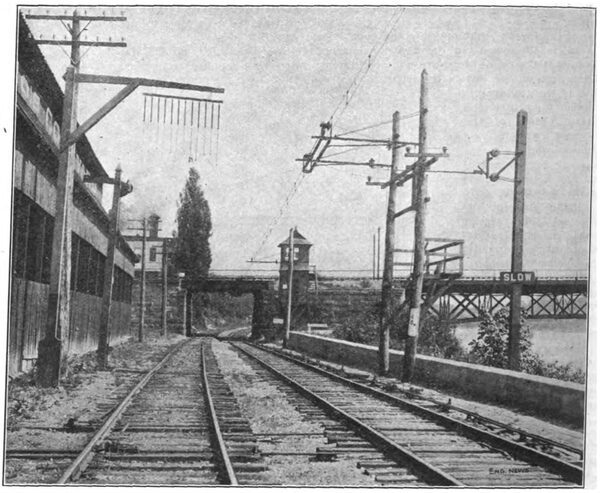 Fig. 9. APPROACH TO THE CLARISSA ST. BRIDGE, ROCHESTER, N. Y., SHOWING SECTION BREAK AND WARNING SIGNAL.