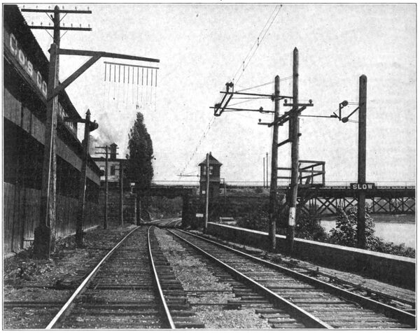 OVERHEAD CONSTRUCTION AT CLARISSA STREET BRIDGE, ROCHESTER, SHOWING TROLLEY SECTION INSULATOR, BRIDGE WARNING AND BLOCK SIGNAL TOWER
