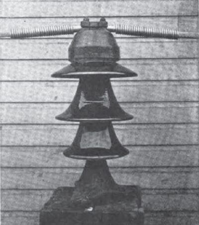 FIG. 18.--INSULATOR WITH CLAMP.