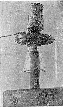 FIG. 1. - THE WATER RUNS OFF IN A SOLID STREAM AT NO VOLTAGE.