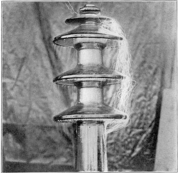 FIG. 13. EXPERIMENTAL INSULATOR UNDER TEST AT 198 KILOVOLTS.
