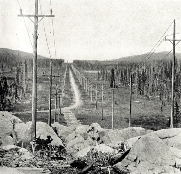 THE 57,000-VOLT TRANSMISSION LINE OF THE MISSOURI RIVER POWER COMPANY AT THE SUMMIT OF THE CONTINENTAL DIVIDE, 7,300 FEET ABOVE SEA LEVEL, WHERE THE LINES PASS FROM THE ATLANTIC TO THE PACIFIC SLOPE.