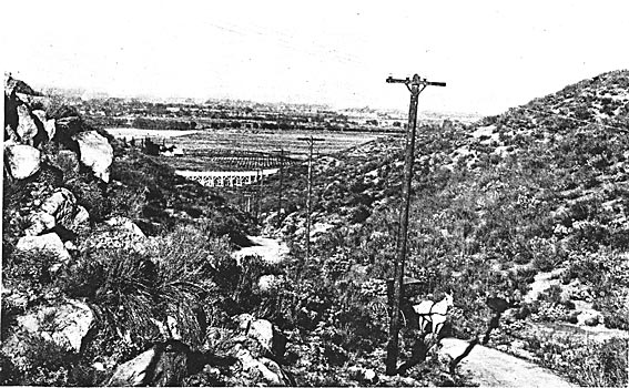 FIGURE 4. - ALONG THE POLE LINE FROM MOUNTAIN TO VALLEY.