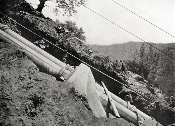 AN ANCHORING PIER ON A MOUNTAIN SIDE PIPE LINE BELONGING TO THE HYDRAULIC PLANT OF THE STANDARD ELECTRIC COMPANY OF CALIFORNIA.