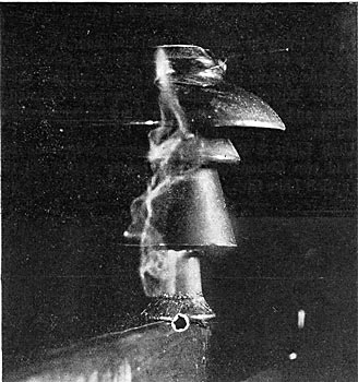 FIG. 14. - INSULATOR UNDER TEST AT 75,000 VOLTS.