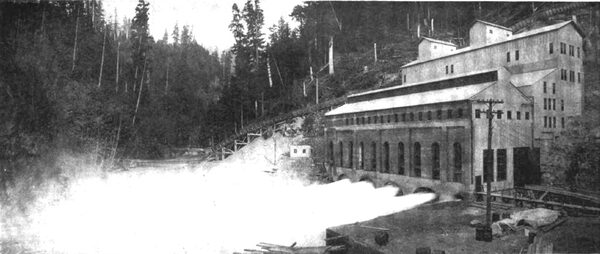FIG. 1. � WEST VIEW OF POWER HOUSE, SHOWING FOUR GENERATORS IN OPERATION,, ALSO SHOWING TEMPORARY END WALL,, ALSO GRADING AND TRENCHING TO RIGHT TO FACILITATE INSTALLATION OF FOUR ADDITIONAL PENSTOCKS AND GENERATORS.