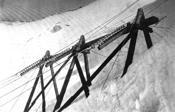 A SIDE HILL SUPPORT IN EDGE OF SNOW SLIDE