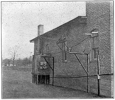 HIGH-TENSION INSULATORS - THE HIGH-POTENTIAL LABORATORY, SHOWING CABIN FOR WET TESTS.