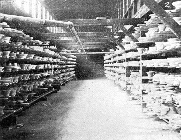 STEAM HEATED DRYING ROOM WITH PORCELAIN ON SHELVES IN PROCESS OF DRYING.