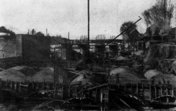 Fig. 4 -- CONCRETE FOUNDATIONS OF POWER HOUSE IN COURSE OF ERECTION DURING WINTER.