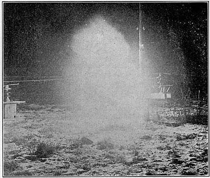 FIG. 8. - Night photograph of a 30,000-kw. 1200-ampere arc on an insulator equipped with arcing rings.