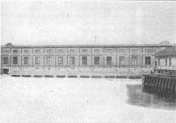 Fig. 4--Forebay Showing New Gate House and Portion of Old Gate House.