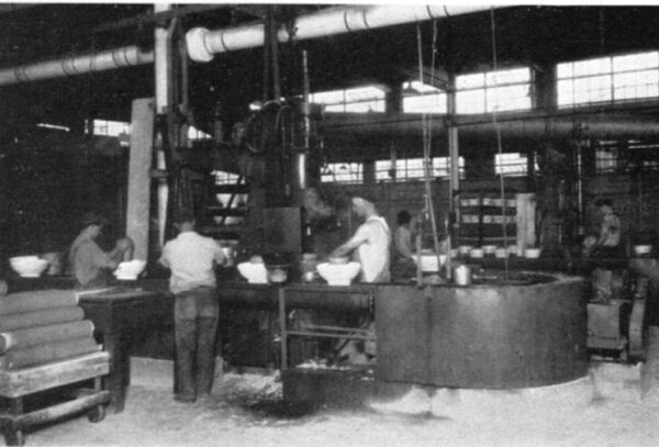Hot Pressing of One-Piece Pin Type Insulators. Mold Release Dryer in Background.