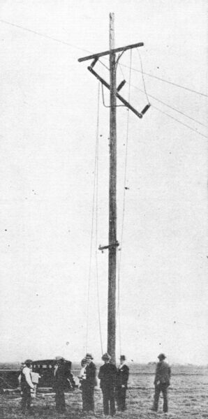Fig. 3�Mechanical test of line-post insulators made by cutting conductors. Damage to pole and crossarm is apparent, but the insulators were unharmed.