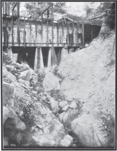 SAND IS FLUSHED OUT THROUGH HOLES IN THE BOTTOM OF THE SAND BOX