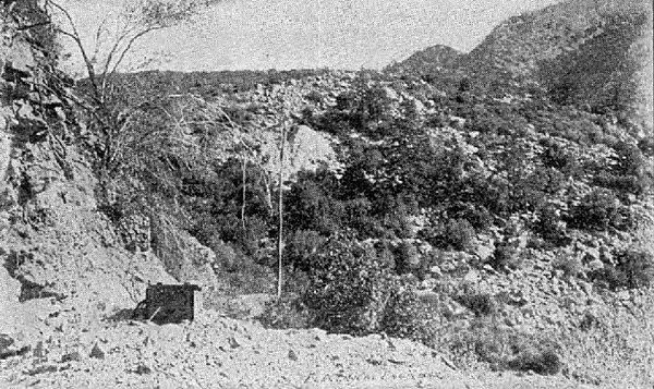 OUTLET OF TUNNEL, PIPE LINE IN CENTRE OF PICTURE.