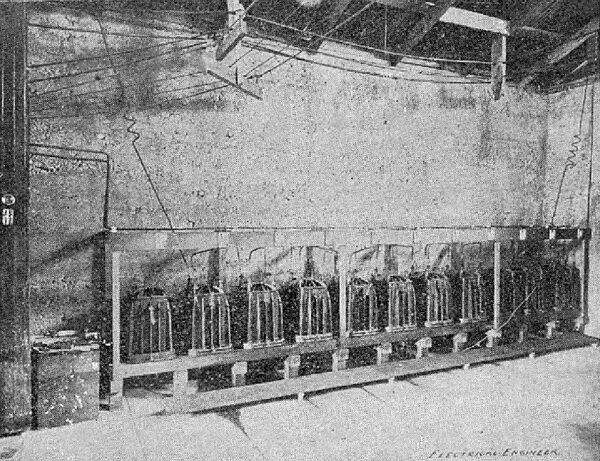 BANK OF 10,000 VOLT TRANSFORMER.