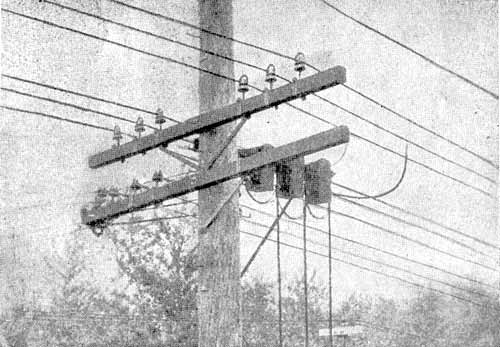 FIG. 3  -  4400-VOLT FEEDERS CARRIED ON CLAMP INSULATORS AND CLAMP PINS.