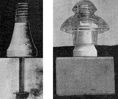 AN IRON PIN WITH WOODEN TOP, PORCELAIN BASE AND GLASS INSULATOR.