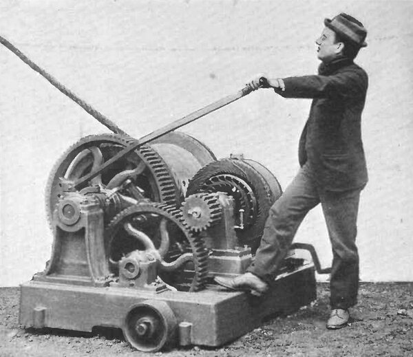 AN ALTERNATING CURRENT INDUCTION MOTOR, GEARED TO A HOIST.