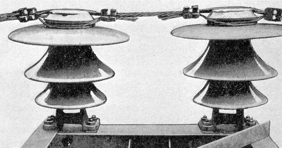 FIG. 32. - DOUBLE INSULATOR ON TOWER, SHOWING METHOD OF TYING.