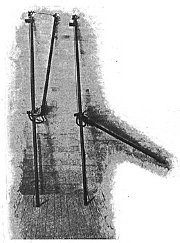 FIG 6. � TWO OF THE FUSE CIRCUIT-BREAKERS REMOVED FROM THEIR CONTACT PANELS./When the fuse, which is shown in place in the left-hand breaker, is burned, the short arm rotates to the position shown in the right-hand breaker, giving a wide gap in the circuit.