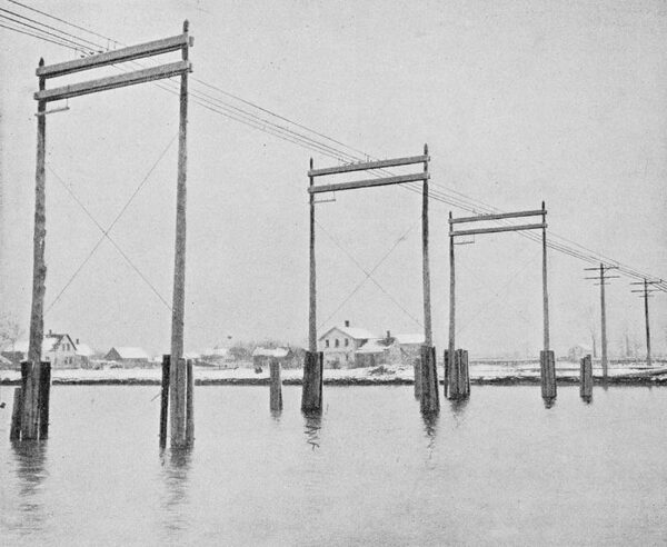 CROSSING  A  CREEK  ALONG  THE  NIAGARA-BUFFALO  TRANSMISSION  LINE.