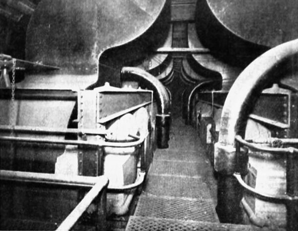 FIG. 5. VIEW ABOVE BOILERS IN FISK STREET PLANT, SHOWING UPTAKES AND STEAM PIPING.