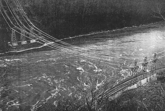 ALUMINUM CABLES TO TRANSMIT ELECTRIC POWER GENERATED AT NIAGARA FALLS FROM CANADA TO THE UNITED STATES OVER NIAGARA RIVER. (THE SPAN IS 600 FEET).